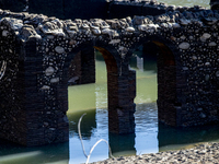 Hundreds of people are visiting the old town of Sant Roma de Sau, where normally the water of the Sau reservoir would almost completely cove...