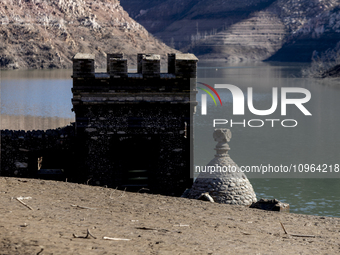 Hundreds of people are visiting the old town of Sant Roma de Sau, where normally the water of the Sau reservoir would almost completely cove...