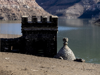 Hundreds of people are visiting the old town of Sant Roma de Sau, where normally the water of the Sau reservoir would almost completely cove...