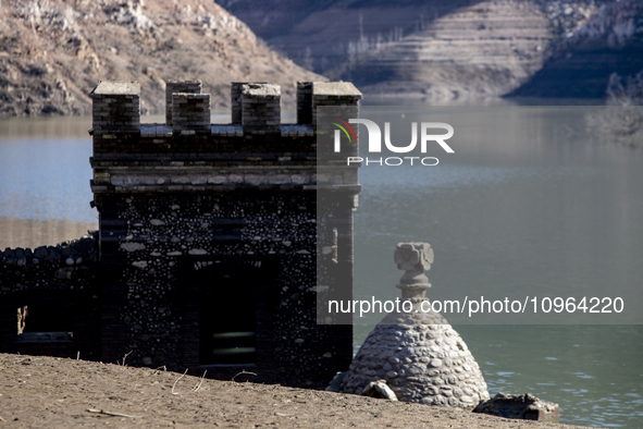 Hundreds of people are visiting the old town of Sant Roma de Sau, where normally the water of the Sau reservoir would almost completely cove...