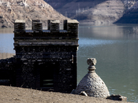 Hundreds of people are visiting the old town of Sant Roma de Sau, where normally the water of the Sau reservoir would almost completely cove...