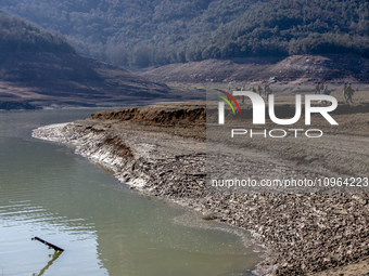 Hundreds of people are visiting the old town of Sant Roma de Sau, where normally the water of the Sau reservoir would almost completely cove...