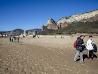 Hundreds of people are visiting the old town of Sant Roma de Sau, where normally the water of the Sau reservoir would almost completely cove...