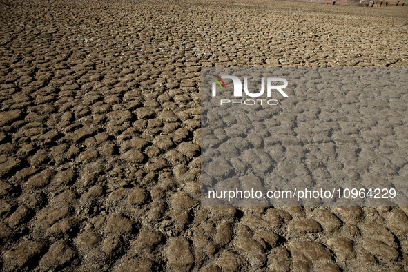 Hundreds of people are visiting the old town of Sant Roma de Sau, where normally the water of the Sau reservoir would almost completely cove...