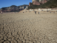 Hundreds of people are visiting the old town of Sant Roma de Sau, where normally the water of the Sau reservoir would almost completely cove...