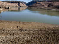 Hundreds of people are visiting the old town of Sant Roma de Sau, where normally the water of the Sau reservoir would almost completely cove...