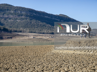 Hundreds of people are visiting the old town of Sant Roma de Sau, where normally the water of the Sau reservoir would almost completely cove...