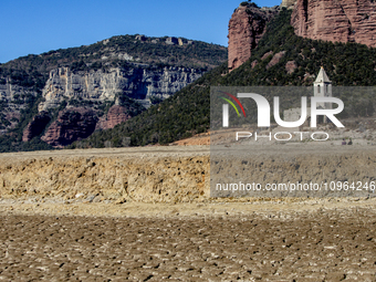 Hundreds of people are visiting the old town of Sant Roma de Sau, where normally the water of the Sau reservoir would almost completely cove...