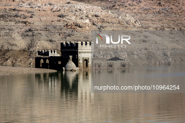 Hundreds of people are visiting the old town of Sant Roma de Sau, where normally the water of the Sau reservoir would almost completely cove...