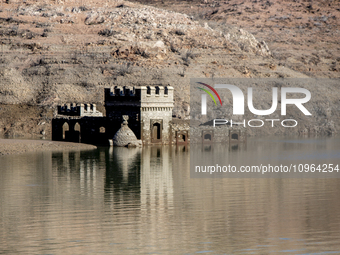 Hundreds of people are visiting the old town of Sant Roma de Sau, where normally the water of the Sau reservoir would almost completely cove...