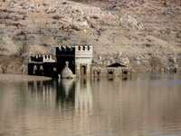 Hundreds of people are visiting the old town of Sant Roma de Sau, where normally the water of the Sau reservoir would almost completely cove...