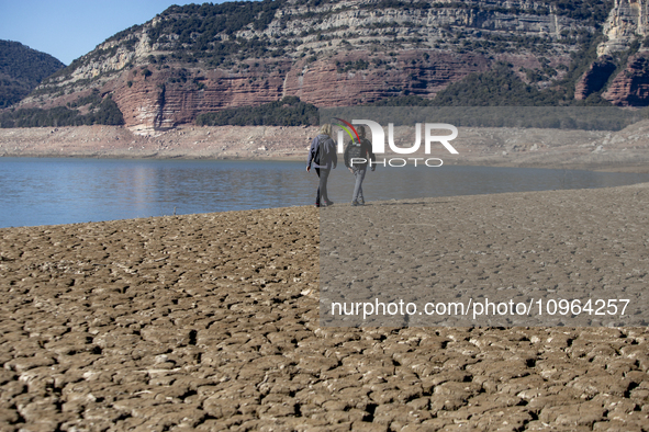 Hundreds of people are visiting the old town of Sant Roma de Sau, where normally the water of the Sau reservoir would almost completely cove...