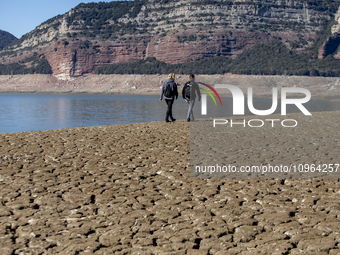 Hundreds of people are visiting the old town of Sant Roma de Sau, where normally the water of the Sau reservoir would almost completely cove...