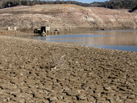 Hundreds of people are visiting the old town of Sant Roma de Sau, where normally the water of the Sau reservoir would almost completely cove...