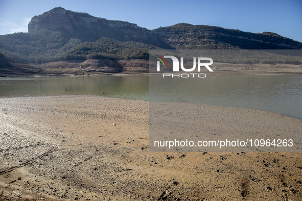 Hundreds of people are visiting the old town of Sant Roma de Sau, where normally the water of the Sau reservoir would almost completely cove...