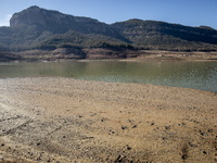 Hundreds of people are visiting the old town of Sant Roma de Sau, where normally the water of the Sau reservoir would almost completely cove...