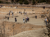 Hundreds of people are visiting the old town of Sant Roma de Sau, where normally the water of the Sau reservoir would almost completely cove...