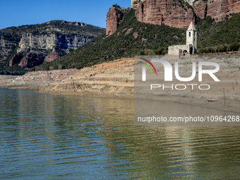 Hundreds of people are visiting the old town of Sant Roma de Sau, where normally the water of the Sau reservoir would almost completely cove...