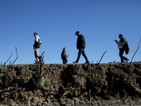 Hundreds of people are visiting the old town of Sant Roma de Sau, where normally the water of the Sau reservoir would almost completely cove...