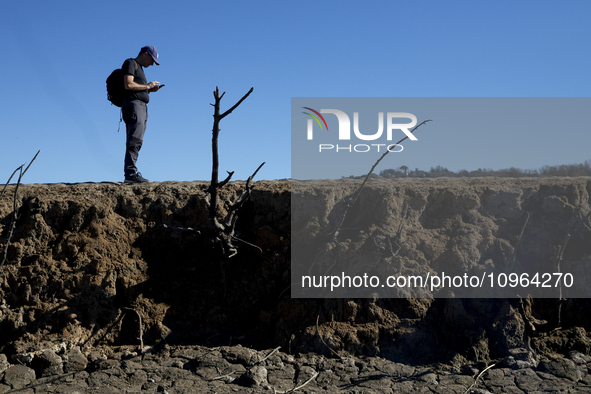 Hundreds of people are visiting the old town of Sant Roma de Sau, where normally the water of the Sau reservoir would almost completely cove...