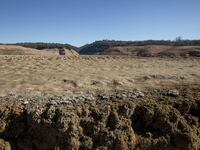 Hundreds of people are visiting the old town of Sant Roma de Sau, where normally the water of the Sau reservoir would almost completely cove...