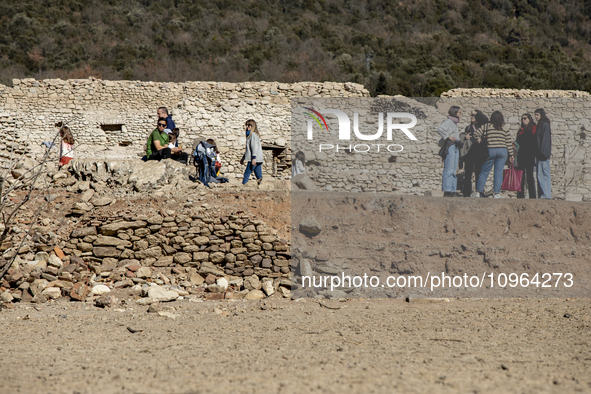 Hundreds of people are visiting the old town of Sant Roma de Sau, where normally the water of the Sau reservoir would almost completely cove...