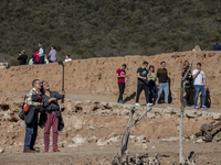 Hundreds of people are visiting the old town of Sant Roma de Sau, where normally the water of the Sau reservoir would almost completely cove...