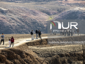 Hundreds of people are visiting the old town of Sant Roma de Sau, where normally the water of the Sau reservoir would almost completely cove...