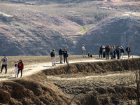 Hundreds of people are visiting the old town of Sant Roma de Sau, where normally the water of the Sau reservoir would almost completely cove...