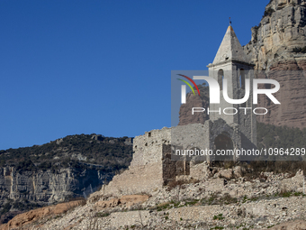 Hundreds of people are visiting the old town of Sant Roma de Sau, where normally the water of the Sau reservoir would almost completely cove...