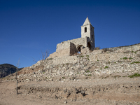 Hundreds of people are visiting the old town of Sant Roma de Sau, where normally the water of the Sau reservoir would almost completely cove...