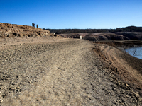 Hundreds of people are visiting the old town of Sant Roma de Sau, where normally the water of the Sau reservoir would almost completely cove...