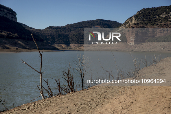 Hundreds of people are visiting the old town of Sant Roma de Sau, where normally the water of the Sau reservoir would almost completely cove...