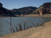 Hundreds of people are visiting the old town of Sant Roma de Sau, where normally the water of the Sau reservoir would almost completely cove...