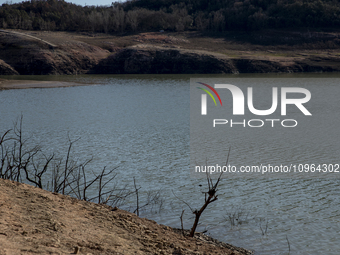 Hundreds of people are visiting the old town of Sant Roma de Sau, where normally the water of the Sau reservoir would almost completely cove...