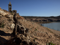 Hundreds of people are visiting the old town of Sant Roma de Sau, where normally the water of the Sau reservoir would almost completely cove...