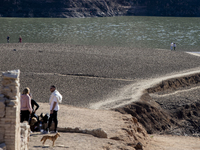 Hundreds of people are visiting the old town of Sant Roma de Sau, where normally the water of the Sau reservoir would almost completely cove...