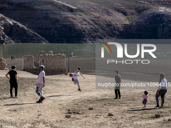 Hundreds of people are visiting the old town of Sant Roma de Sau, where normally the water of the Sau reservoir would almost completely cove...