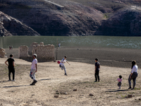 Hundreds of people are visiting the old town of Sant Roma de Sau, where normally the water of the Sau reservoir would almost completely cove...