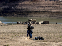 Hundreds of people are visiting the old town of Sant Roma de Sau, where normally the water of the Sau reservoir would almost completely cove...