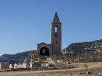 Hundreds of people are visiting the old town of Sant Roma de Sau, where normally the water of the Sau reservoir would almost completely cove...