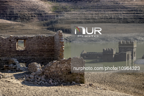 Hundreds of people are visiting the old town of Sant Roma de Sau, where normally the water of the Sau reservoir would almost completely cove...