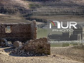 Hundreds of people are visiting the old town of Sant Roma de Sau, where normally the water of the Sau reservoir would almost completely cove...