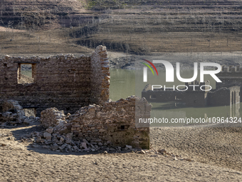 Hundreds of people are visiting the old town of Sant Roma de Sau, where normally the water of the Sau reservoir would almost completely cove...