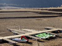 Hundreds of people are visiting the old town of Sant Roma de Sau, where normally the water of the Sau reservoir would almost completely cove...