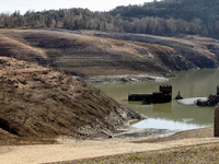 Hundreds of people are visiting the old town of Sant Roma de Sau, where normally the water of the Sau reservoir would almost completely cove...