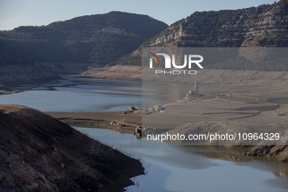 Hundreds of people are visiting the old town of Sant Roma de Sau, where normally the water of the Sau reservoir would almost completely cove...