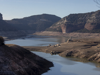 Hundreds of people are visiting the old town of Sant Roma de Sau, where normally the water of the Sau reservoir would almost completely cove...