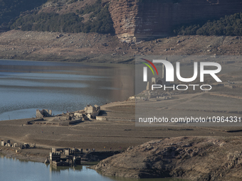 Hundreds of people are visiting the old town of Sant Roma de Sau, where normally the water of the Sau reservoir would almost completely cove...