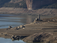 Hundreds of people are visiting the old town of Sant Roma de Sau, where normally the water of the Sau reservoir would almost completely cove...